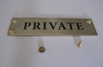 Brass plaque with dome fixings