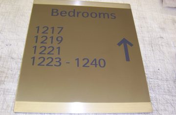 One of 2,000 shaded brass hotel signs