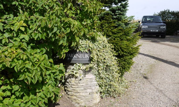 Curved Bronze house sign