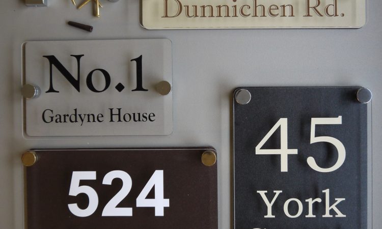 Various sized Perspex House Signs